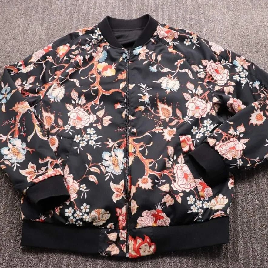 Elegant floral sublimation on a satin jacket